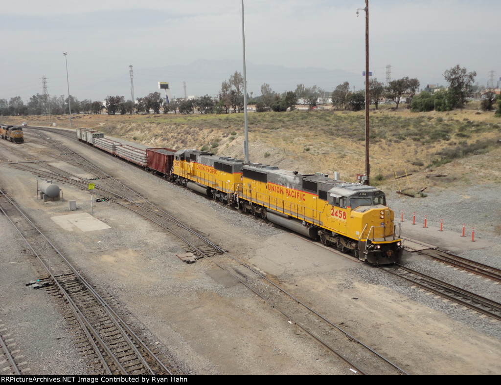 UP SD60Ms leading a Work Train